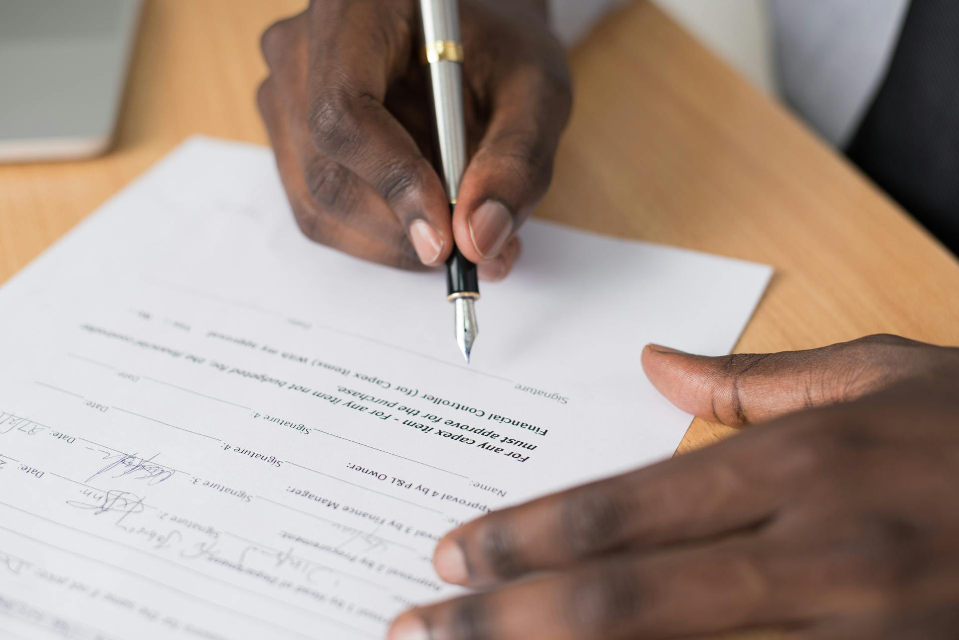 Man signing escrow paperwork