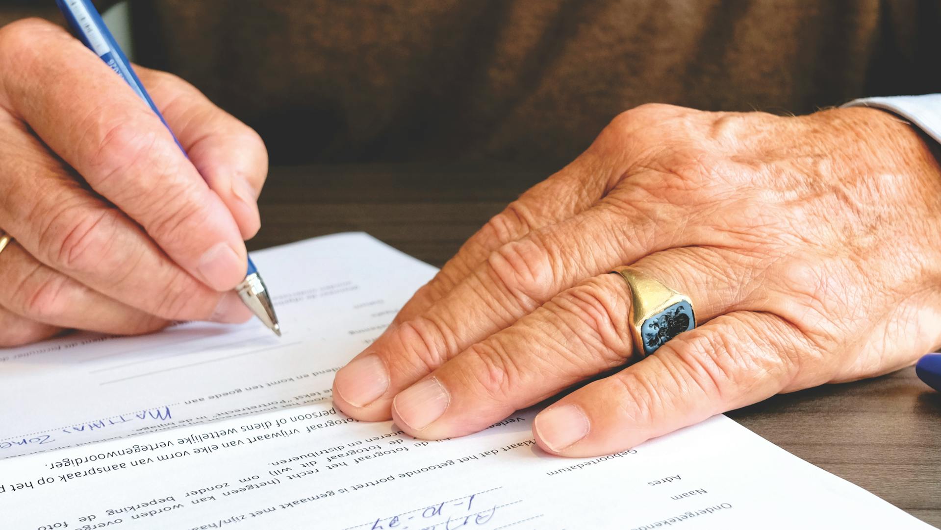 Man signing a mortgage document