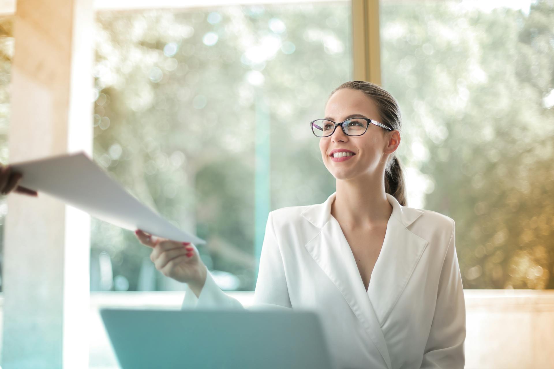 Woman handing over title insurance documents